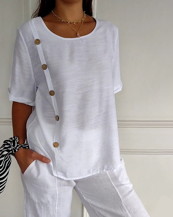 Top van lichte stof met knoopdetails